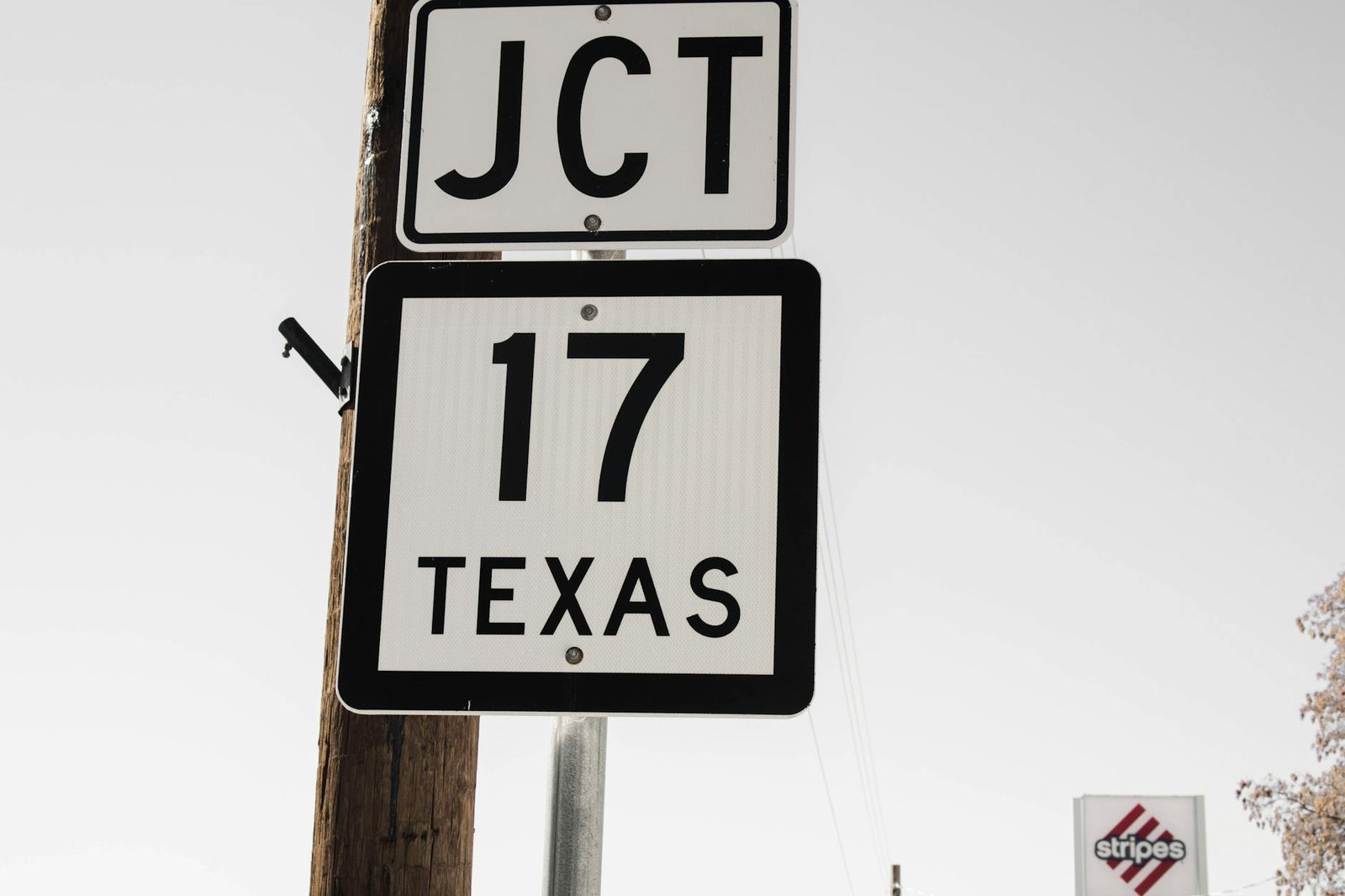 Road sign for Texas State Highway 17 with clear sky background.
