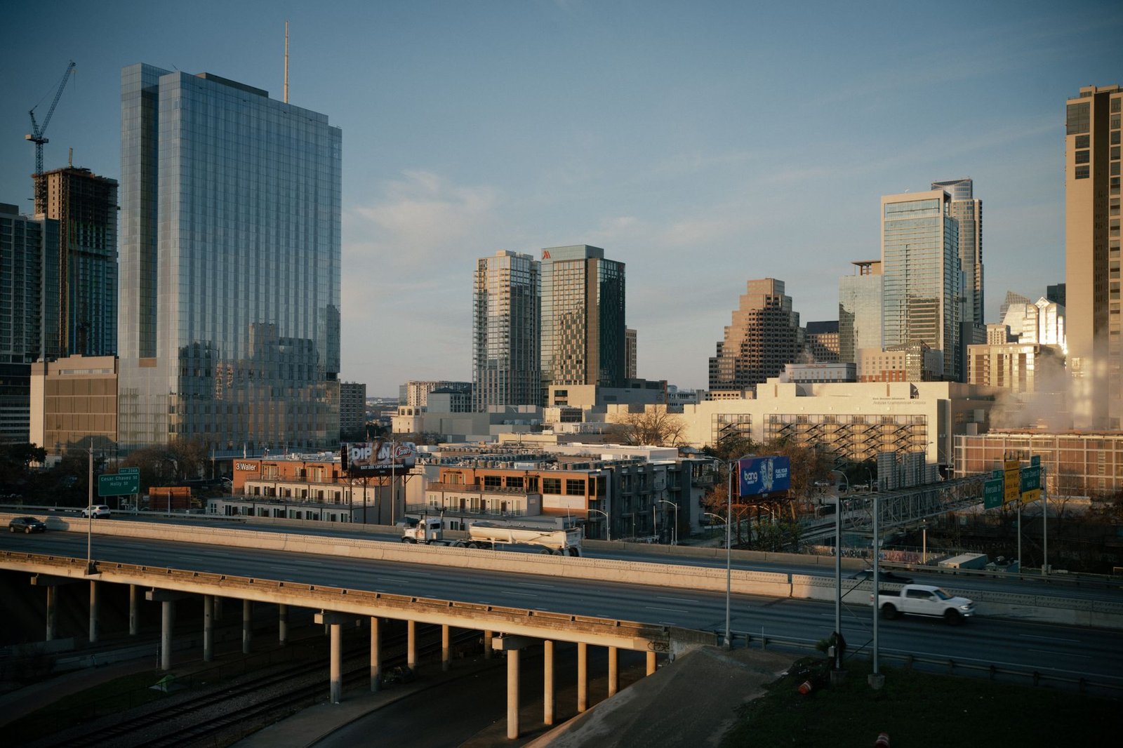 Aerial view of downtown Austin, Texas showcasing modern skyscrapers and urban infrastructure at dusk.